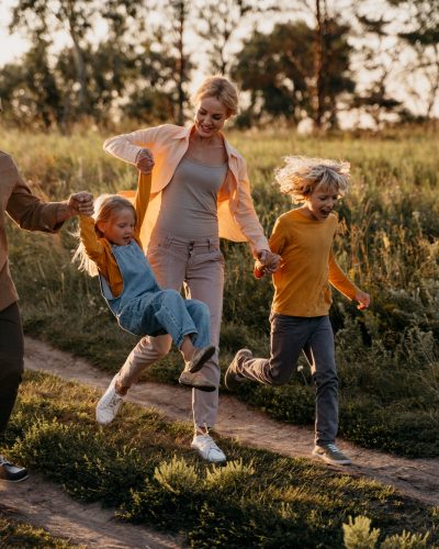 full-shot-family-running-meadow (1)